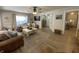 Bright living room featuring wood floors, a ceiling fan, a cozy seating area, and natural light at 71 W County Road 500 S, Clayton, IN 46118
