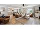 Welcoming living room featuring hardwood floors, comfortable seating, and a seamless flow to the kitchen at 71 W County Road 500 S, Clayton, IN 46118