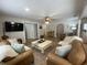 Inviting living room offers an open floor plan, comfortable leather sofas, and a neutral color palette at 71 W County Road 500 S, Clayton, IN 46118