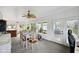 Sunroom featuring a dining table, ceiling fan, exercise bike, and multiple windows for natural light at 71 W County Road 500 S, Clayton, IN 46118