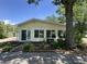 Sunroom addition with ample windows and a side door entrance, surrounded by greenery at 71 W County Road 500 S, Clayton, IN 46118