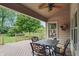Enjoy outdoor dining on this back deck featuring a ceiling fan and scenic view of the backyard at 7329 Pymbroke Dr, Fishers, IN 46038