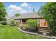 Inviting backyard with a spacious deck, lush landscaping, and a charming seating area at 7329 Pymbroke Dr, Fishers, IN 46038