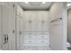Bright bathroom features large linen closet with built-in shelving and ample storage space at 7329 Pymbroke Dr, Fishers, IN 46038