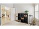 Carpeted bedroom featuring a nine-cube shelving unit and view to living spaces at 7329 Pymbroke Dr, Fishers, IN 46038