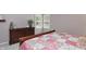Bedroom featuring a wooden sleigh bed, dresser with decorative vase and a window with shutters at 7329 Pymbroke Dr, Fishers, IN 46038