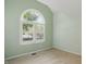 Bright bedroom with a transom window offering ample natural light and neutral walls at 7329 Pymbroke Dr, Fishers, IN 46038