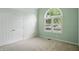 Bedroom features double door closet and transom window for natural light at 7329 Pymbroke Dr, Fishers, IN 46038