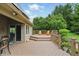 Relaxing deck area with chairs, green views and sliding doors to the interior at 7329 Pymbroke Dr, Fishers, IN 46038