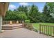 Spacious backyard deck featuring chairs, railings and green views at 7329 Pymbroke Dr, Fishers, IN 46038