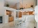 Open dining area with white table, views of the kitchen and living area, blending living spaces seamlessly at 7329 Pymbroke Dr, Fishers, IN 46038