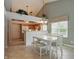 Cozy dining area with white table, view of kitchen, and natural light, creating a warm atmosphere at 7329 Pymbroke Dr, Fishers, IN 46038