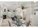 Open concept dining area showing vaulted ceilings, chandelier lighting and fireplace at 7329 Pymbroke Dr, Fishers, IN 46038