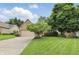 Charming brick home with a well-manicured front yard and a paved driveway at 7329 Pymbroke Dr, Fishers, IN 46038