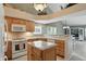 Kitchen featuring wood cabinets, granite countertops, and stainless steel appliances at 7329 Pymbroke Dr, Fishers, IN 46038