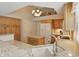 Well-lit eat-in kitchen features modern appliances, granite counters, island and pendant lighting at 7329 Pymbroke Dr, Fishers, IN 46038