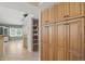Bright eat-in kitchen boasts ample cabinet storage, display shelving, and open layout with tile flooring at 7329 Pymbroke Dr, Fishers, IN 46038