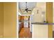 The kitchen has wood cabinets, and white appliances with a serving area open to dining at 740 Carya Sq, Columbus, IN 47201