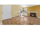 Bright living room featuring a cozy fireplace, a window seat and neutral tile flooring at 740 Carya Sq, Columbus, IN 47201