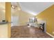 Open living room with tile floors, a fireplace, and a breakfast bar leading to the kitchen at 740 Carya Sq, Columbus, IN 47201