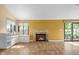 Bright living room with fireplace, window seat and sliding glass door to the outside at 740 Carya Sq, Columbus, IN 47201