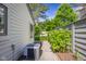 Side yard featuring lush greenery, and a well-maintained walkway at 740 Carya Sq, Columbus, IN 47201
