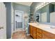 Bright bathroom with dual sink vanity and view to walk in closet at 7452 Lace Bark Ct, Avon, IN 46123
