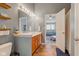 Bright bathroom with dual sink vanity and view to Primary bedroom at 7452 Lace Bark Ct, Avon, IN 46123