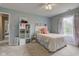Bright bedroom with soft pink accents, light walls, and plenty of shelving at 7452 Lace Bark Ct, Avon, IN 46123