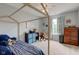 Bright bedroom featuring a house frame bed, neutral walls, a ceiling fan and a patterned window treatment at 7452 Lace Bark Ct, Avon, IN 46123