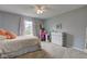 Bright bedroom with soft pink accents, light walls, and a dedicated study area at 7452 Lace Bark Ct, Avon, IN 46123