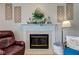 Cozy fireplace featuring white mantel with decorative accents and tiles around the firebox at 7452 Lace Bark Ct, Avon, IN 46123