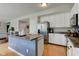 Bright kitchen with stainless steel refrigerator, light countertops, and white cabinetry at 7452 Lace Bark Ct, Avon, IN 46123