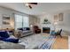 Bright living room with ample seating, fireplace, and modern decor at 7452 Lace Bark Ct, Avon, IN 46123