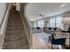 Bright living room featuring hardwood floors, a ceiling fan, and large windows at 7452 Lace Bark Ct, Avon, IN 46123