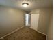 Bedroom with neutral walls, carpet, and a closet at 7514 Ruskin Pl, Indianapolis, IN 46226