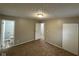Bedroom with neutral walls, carpet, a closet, and doorway leading to another room at 7514 Ruskin Pl, Indianapolis, IN 46226
