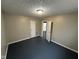 Bedroom with neutral walls, dark floors, and a closet at 7514 Ruskin Pl, Indianapolis, IN 46226