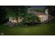 Beautiful backyard with mature trees, patio, and staircase at 7624 William Penn Pl, Indianapolis, IN 46256