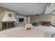Cozy basement featuring a fireplace, a built-in TV, and comfortable seating, perfect for relaxation at 7624 William Penn Pl, Indianapolis, IN 46256