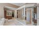 Luxurious bathroom with a glass-enclosed shower and dual vanities at 7624 William Penn Pl, Indianapolis, IN 46256