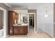 Bathroom vanity with dark wood cabinets, mirrors, and walk-in closet at 7624 William Penn Pl, Indianapolis, IN 46256
