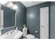 Stylish bathroom featuring modern vanity, decor, neutral color scheme, and hardware at 7624 William Penn Pl, Indianapolis, IN 46256