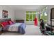 Bedroom with a large window overlooking a peaceful backyard and a comfortable layout at 7624 William Penn Pl, Indianapolis, IN 46256