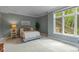 Serene bedroom with a large window and stylish decor at 7624 William Penn Pl, Indianapolis, IN 46256