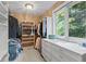 Walk-in closet with built-in shelving and window views at 7624 William Penn Pl, Indianapolis, IN 46256