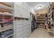 Spacious walk-in closet with custom shelving, drawers, and ample storage at 7624 William Penn Pl, Indianapolis, IN 46256