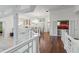 An upstairs view into a formal dining room with a wooden table and chairs at 7624 William Penn Pl, Indianapolis, IN 46256