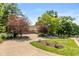 Long, private driveway leading to a beautiful home with manicured landscaping at 7624 William Penn Pl, Indianapolis, IN 46256