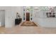 Inviting entryway with a decorative rug and a wooden front door at 7624 William Penn Pl, Indianapolis, IN 46256